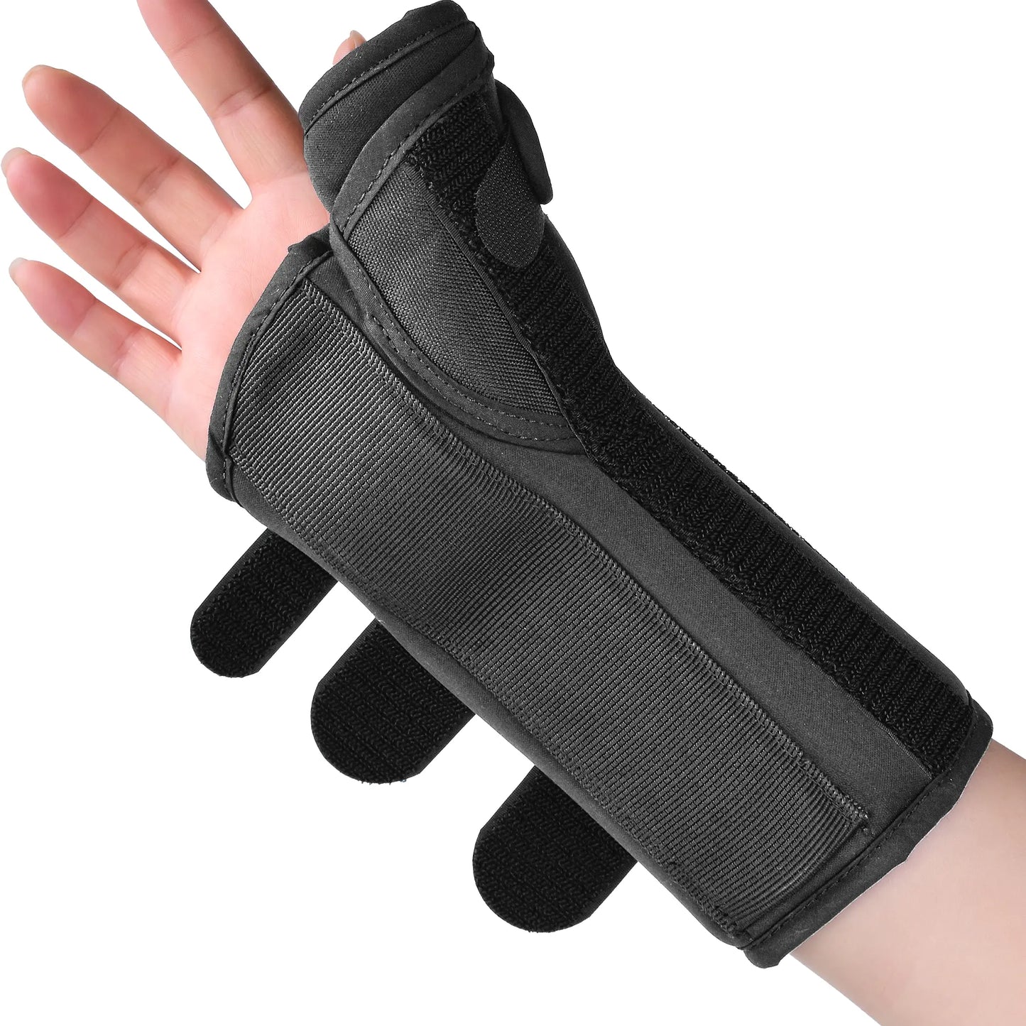 A black wrist and hand support brace worn on a person's hand, shown against a plain white background.