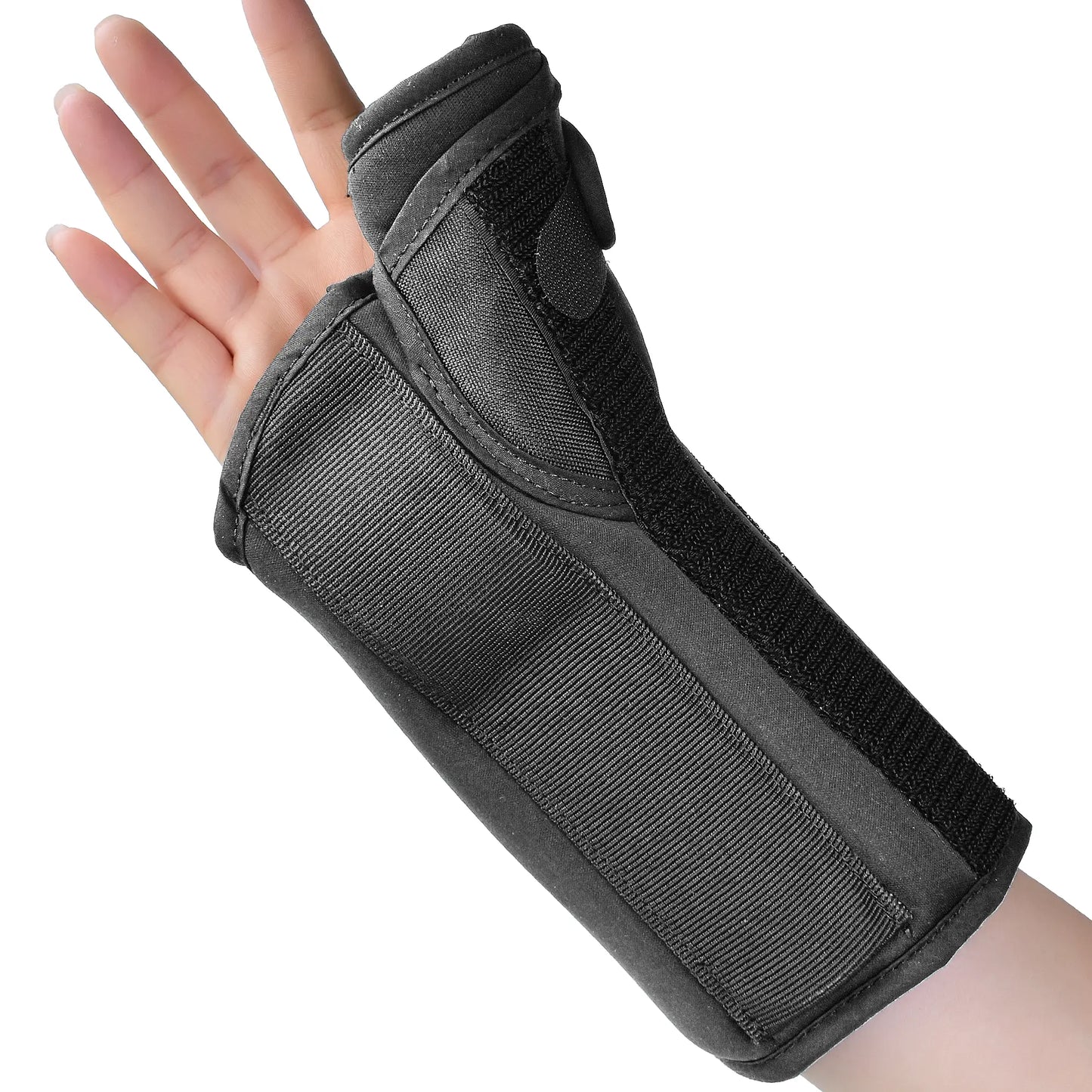 A black wrist and forearm support brace worn on a person's hand, shown against a plain white background.