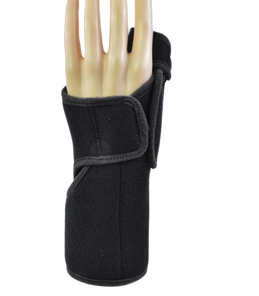 A black neoprene wrist brace with a hook-and-loop strap, shown on a mannequin hand against a plain white background.