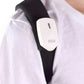 Close-up of electronic posture corrector on back