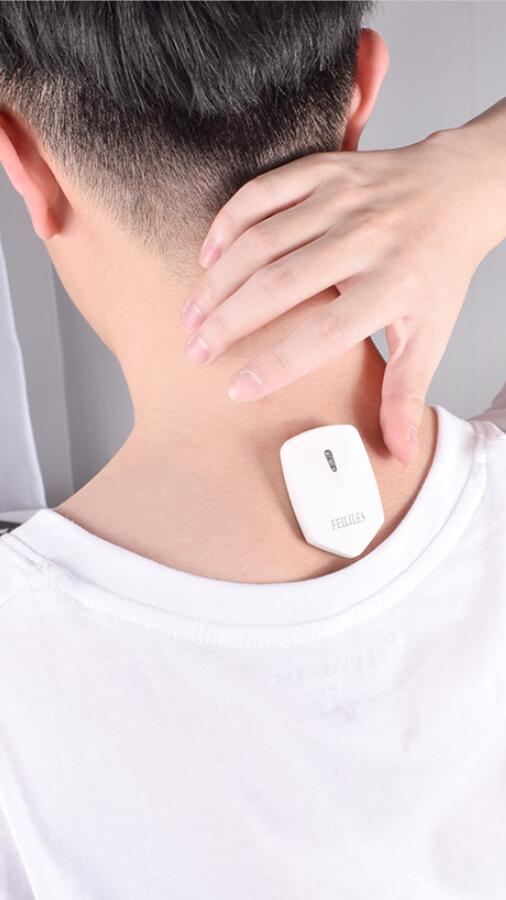 Close-up of electronic posture corrector on back