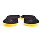 A pair of black athletic shoe insoles with bright yellow sides and a small red and white logo on the bottom, displayed on a clean white background.